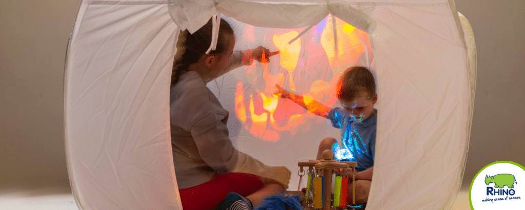 Children exploring their senses inside a sensory den